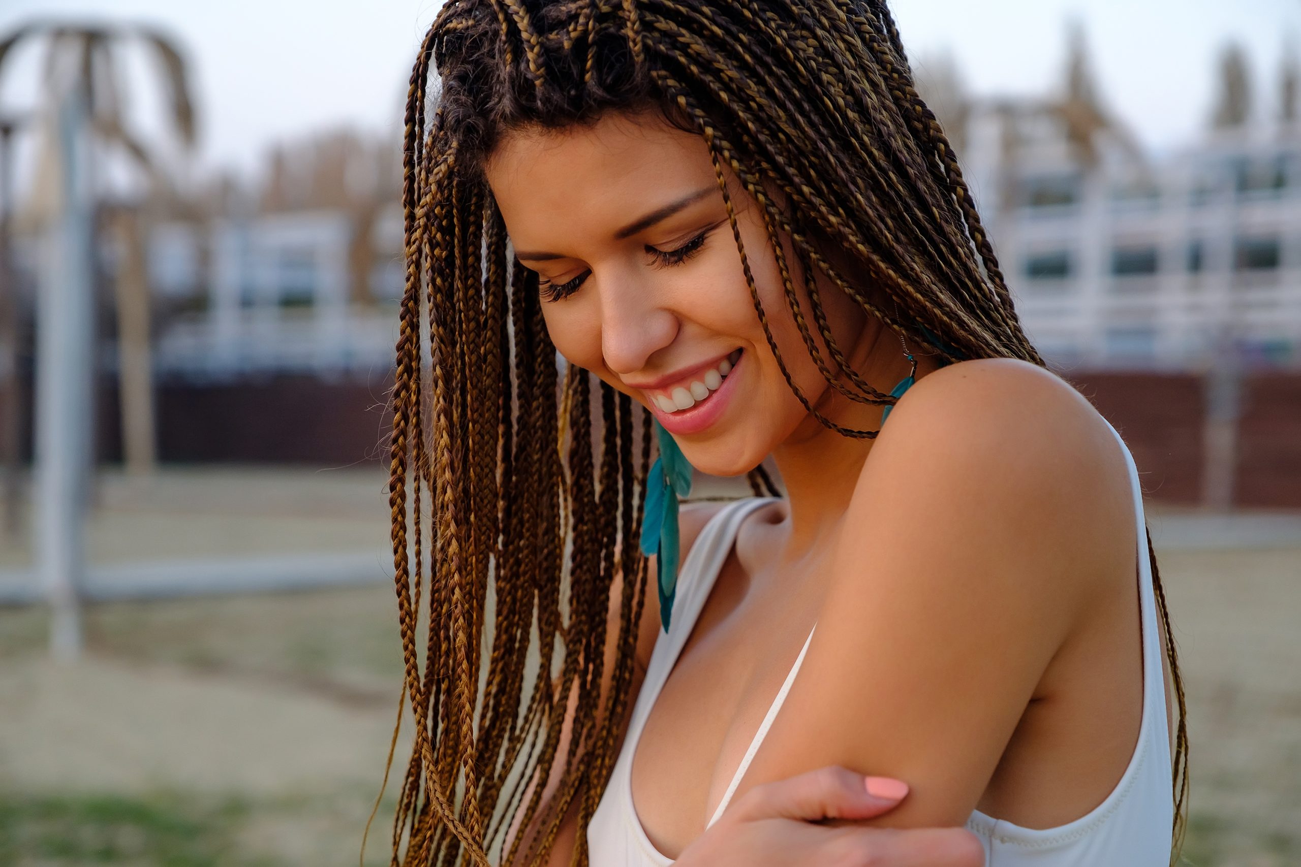 Close up outdoor portrait of attractive asian european model girl with braided hairstyle.