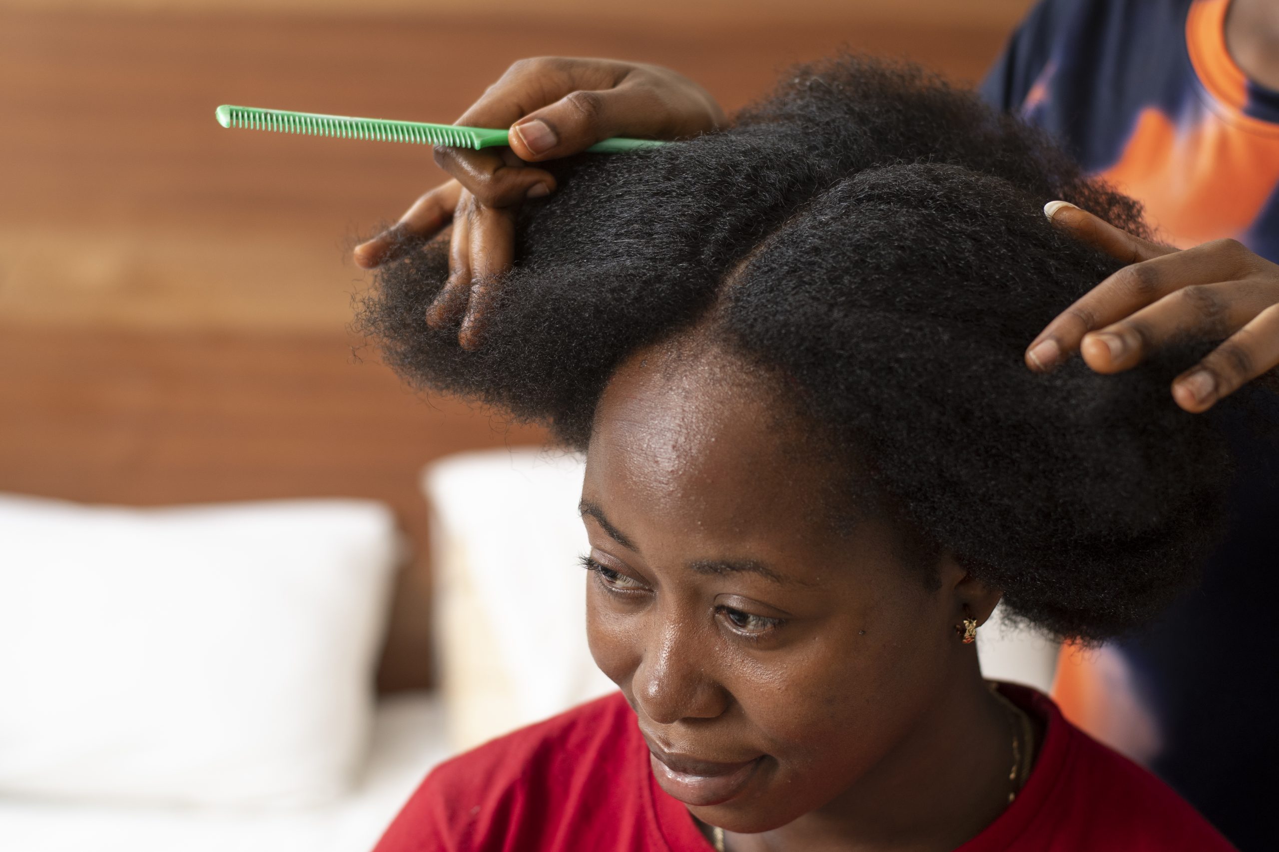 stylist-woman-taking-care-her-client-afro-hair (1)