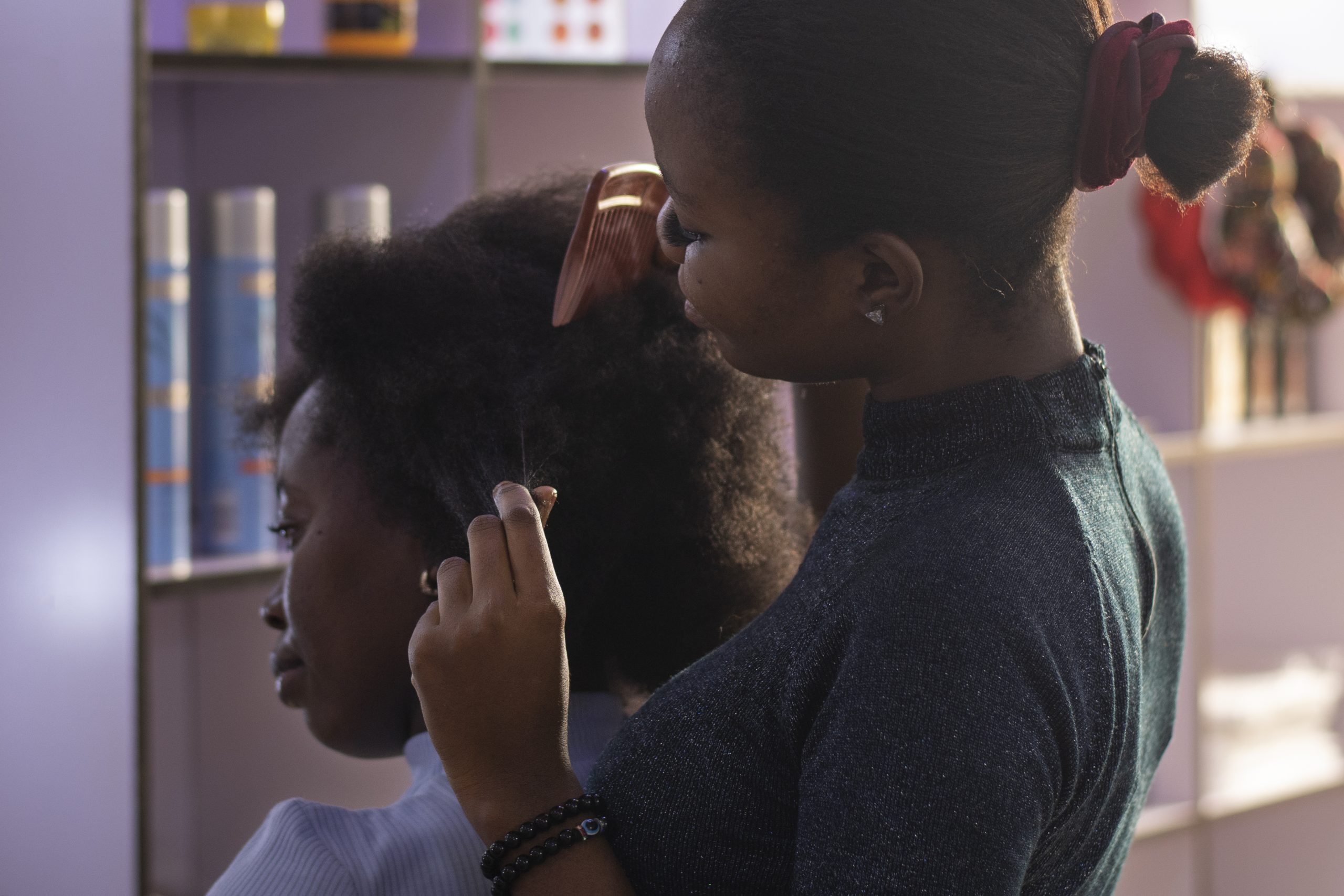 stylist-woman-taking-care-her-client-afro-hair (2)