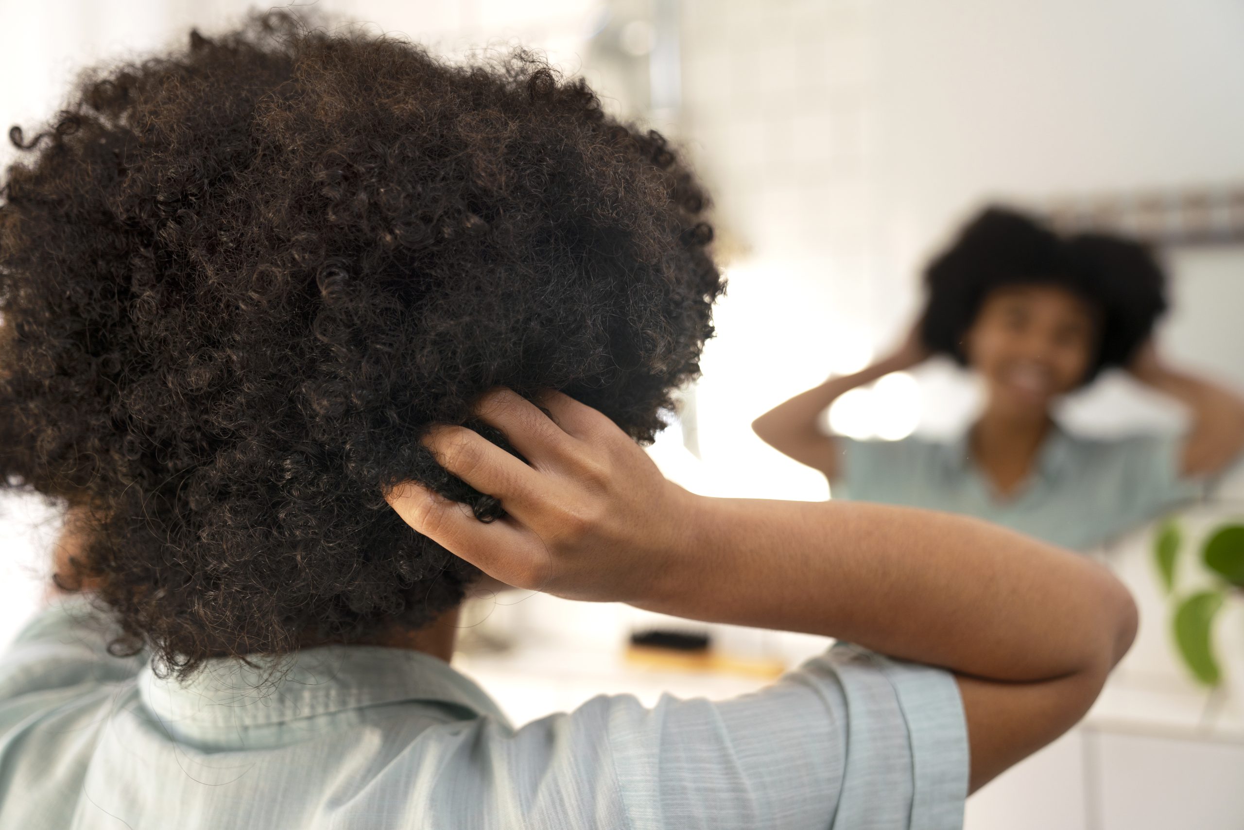young-black-person-taking-care-afro-hair